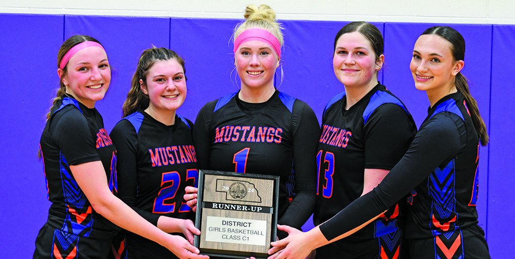 Photo by Melissa Grover The five Mustang seniors show off the hardware as District Runner-up following their hard fought loss to Bridgeport. Those seniors include: (L-R) Haley Johnson, Lillee Schmidt, Trinity Taylor, McKinley Grover, and Skye Tausan.