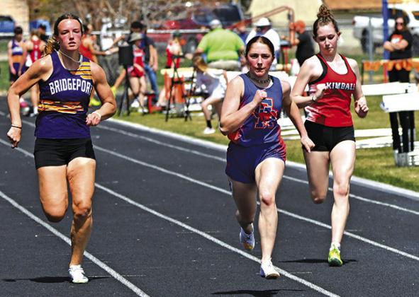 Photo by Melissa Grover Sophomore Kylie Goings pushes for the finish line during the 100 meter race at the Western Trails Conference Invitational.