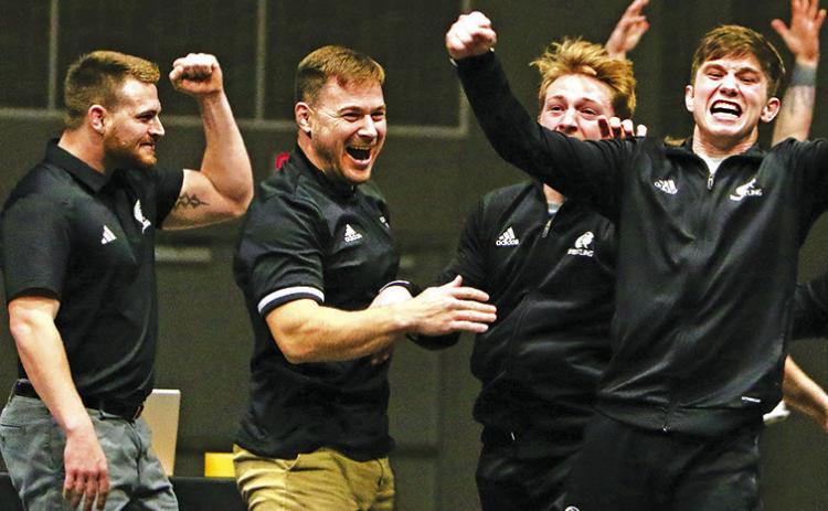 Courtesy Photo Chadron State Wrestling Head Coach Brett Hunter and the Eagles celebrate after winning a dual against Adams State that clinched a share of the Rocky Mountain Athletic Conference title. The Eagles went 8-0 in conference duals on way to winning the conference title.